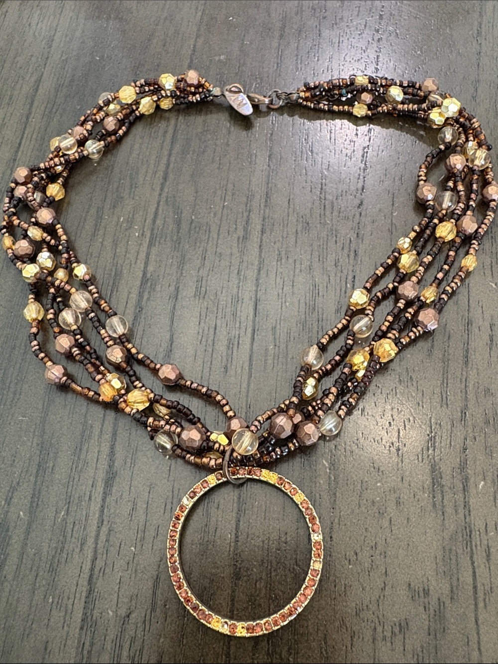 Multi-Strand Brown and Gold Beaded Necklace with Circular Pendant